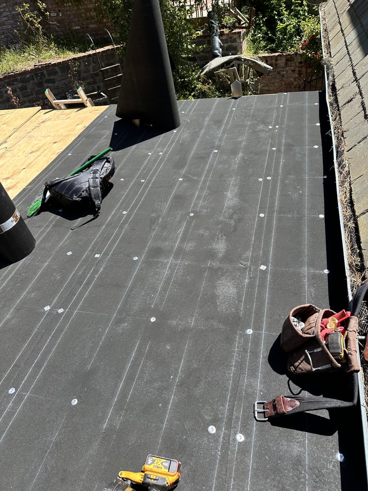 Slide of Rene’s Roofing