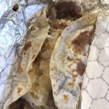 Taco N' Mama - Bistec (steak) taco with grilled onions, refried beans, rice and cheese - Tacos Near Me - Round Rock, Texas Taco N' Mama - Bistec (steak) taco with grilled onions, refried beans, rice and cheese - Tacos Near Me - Round Rock, Texas