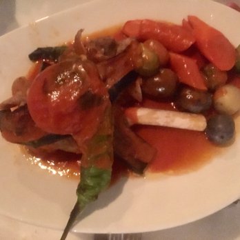 Mandolin Kitchen - Lamb Shank- with baby potatoes, peppers and tomatoes - Mediterranean Near Me - Atlanta, Georgia Mandolin Kitchen - Lamb Shank- with baby potatoes, peppers and tomatoes - Mediterranean Near Me - Atlanta, Georgia