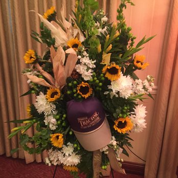 A Village Flower Shop - The team at Village Floral helped us put a personalized touch on my Grandfather's easel sprays by incorporating his hat & crops he had grown - Florists Near Me - Plainfield, Illinois