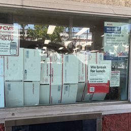 Classy closed for lunch drive thru window. No curtain just post office boxes