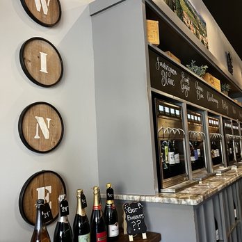 Uva Wine Bar - various bottles of wine on the counter - Wine Bars Near Me - Plymouth, Massachusetts