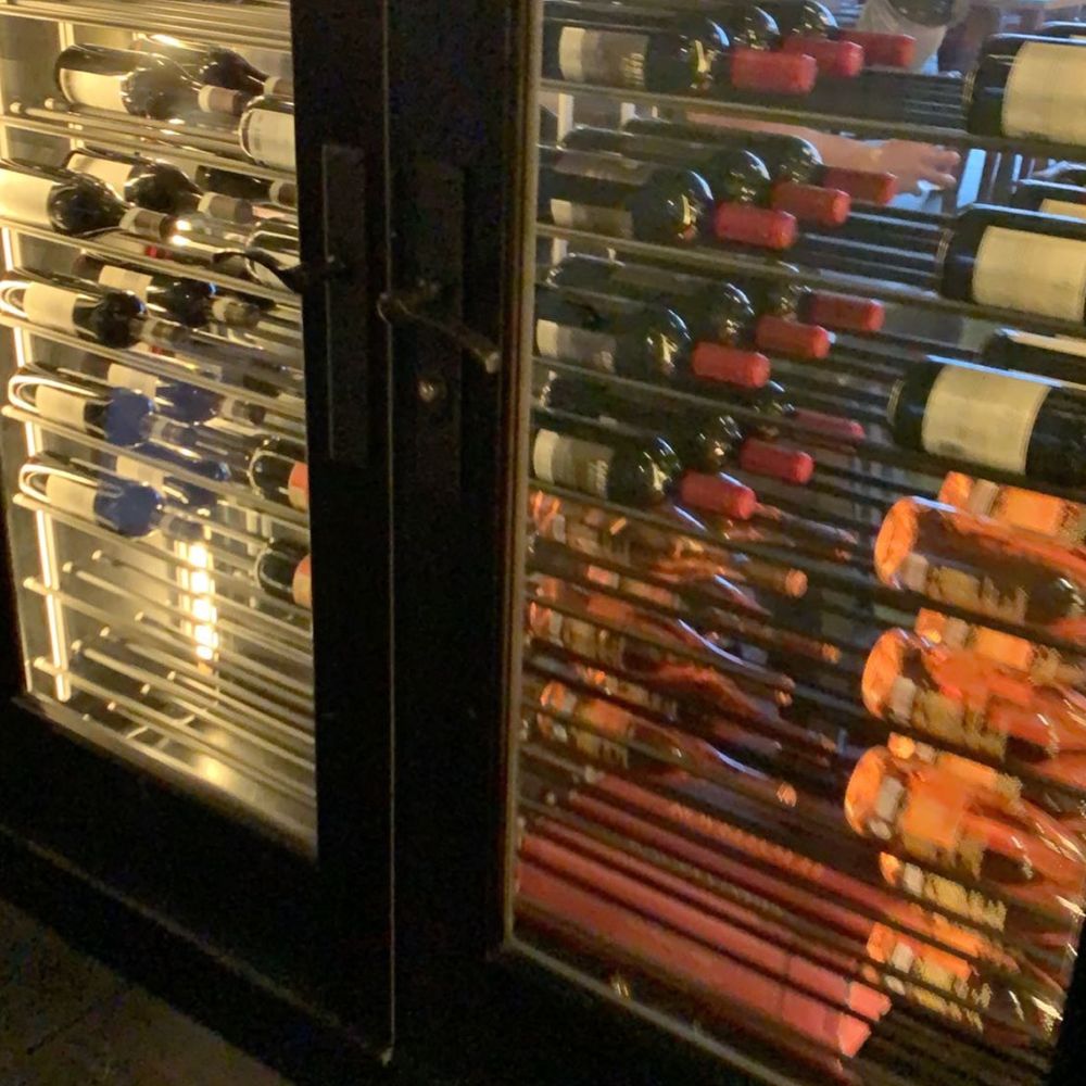 O+O Pizza - Wine wall at back of restaurant by restrooms - Italian Near Me - St. Louis, Missouri O+O Pizza - Wine wall at back of restaurant by restrooms - Italian Near Me - St. Louis, Missouri