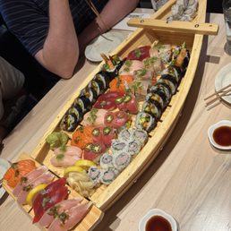 ala carte sushi served in a sushi boat ala carte sushi served in a sushi boat