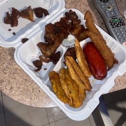 Fried plantains, Sausage & fried pork!! Does this look like white Rice, beans with griot? Fried plantains, Sausage & fried pork!! Does this look like white Rice, beans with griot?