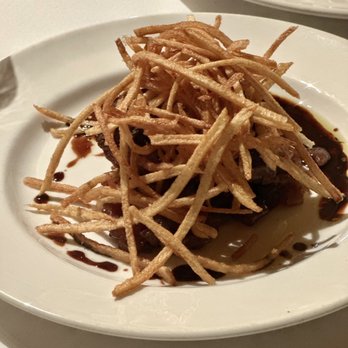 Marios Place - The  Beef Tenderloin with shoestring potatoes on top. - Italian Near Me - Riverside, California