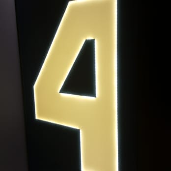 Gioberti Art Hotel - Purple neon floor 4 sign in front of elevator. - Hotels Near Me - Rome, RM