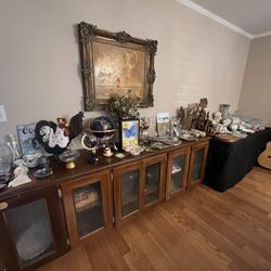 Vintique Finds Estate Sales - Buffett with multiple smaller fragile items on Top