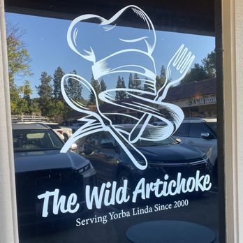 The Wild Artichoke - Logo on front window - New American Near Me - Yorba Linda, California The Wild Artichoke - Logo on front window - New American Near Me - Yorba Linda, California