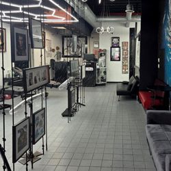 Gothic Ink Studio - Clean, stylish tattoo studio with mural art, comfy lounge, and pro workstations. A creative space for unique, personalized tattoo experience