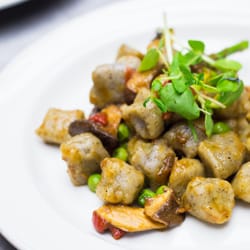 Urban Acorn Catering - Vegan & Gluten Free King Oyster Mushroom Gnocchi tossed in a Roasted Red Pepper Emulsion garnished with Summer Peas