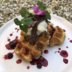 Grounded Grocer & Cafe - Waffles served with berry compote & vanilla bean ice cream & Nutella