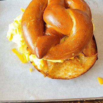 Dandelion Cafe - Egg and cheese sammie on a pretzel roll - Coffee & Tea Near Me - Bellaire, Texas