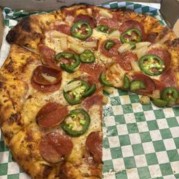 Pepperoni Pizza with pineapple and jalapeño Pepperoni Pizza with pineapple and jalapeño