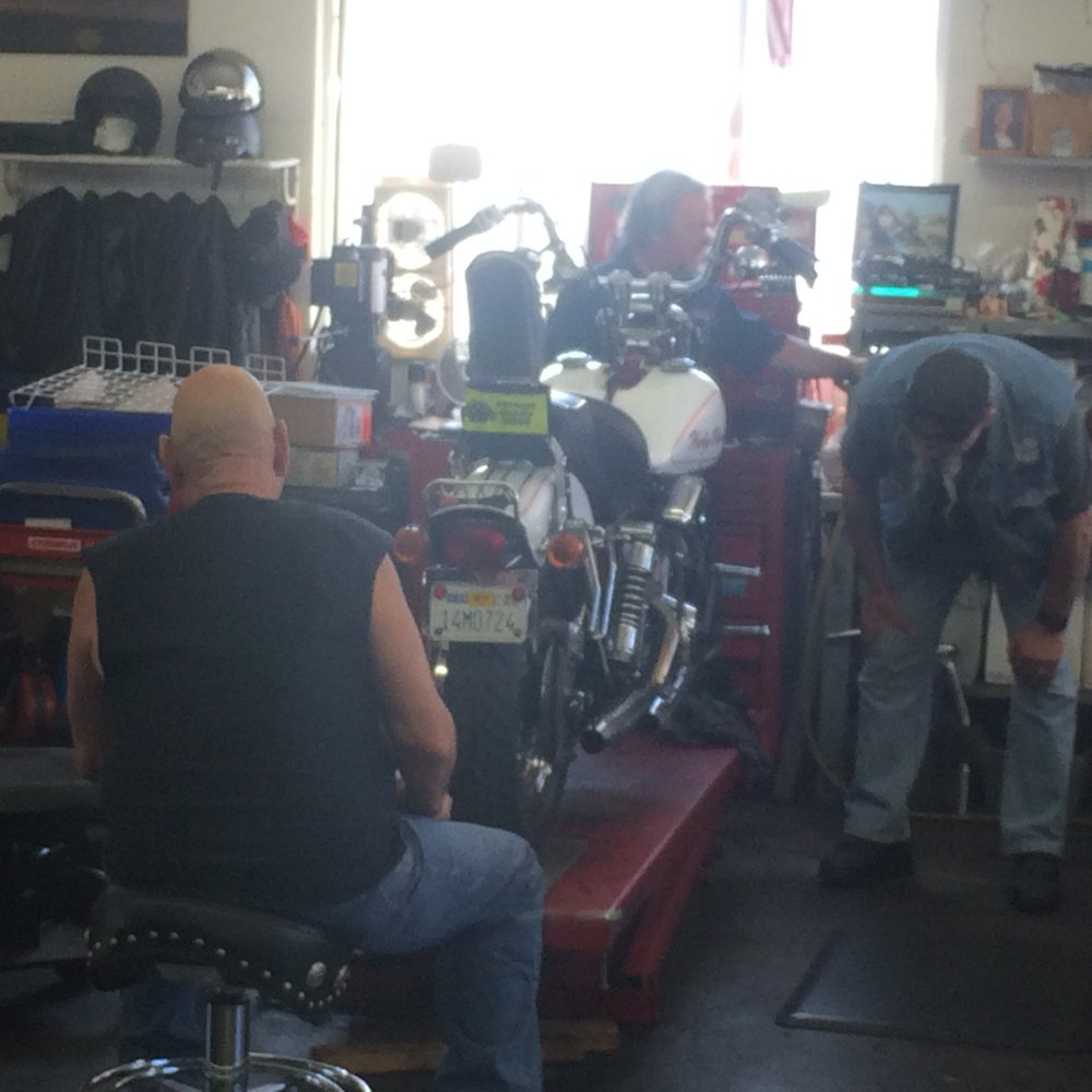 Motorcycle Michael's - Here's Joe at the front of my bike between the handlebars working on my Shovelhead. - Motorcycle Repair Near Me - Gardena, California Motorcycle Michael's - Here's Joe at the front of my bike between the handlebars working on my Shovelhead. - Motorcycle Repair Near Me - Gardena, California