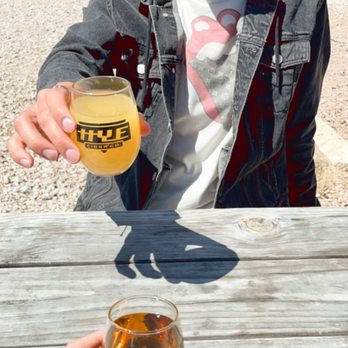 Hye Cider - a man holding a glass of cider - Cideries Near Me - Johnson City, Texas