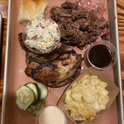 Heritage Smokehouse - Chopped brisket, chicken thing and leg, homemade pickles, potato salad, potato salad, roll, two dipping sauces