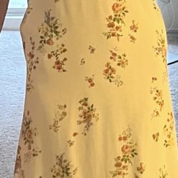 John's Tailor Shop - Second dress final alterations the hips jut out uneven in an otherwise smooth dress