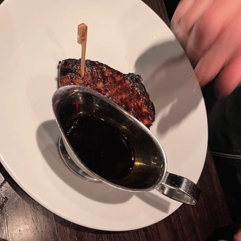 Hot Stove Club - a plate of food with a spoon and sauce - Seafood Near Me - Toronto, Ontario Hot Stove Club - a plate of food with a spoon and sauce - Seafood Near Me - Toronto, Ontario