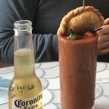 Dona Tola - Bloody Mary comes with an empanada & beer back - Mexican Near Me - Chicago, Illinois Dona Tola - Bloody Mary comes with an empanada & beer back - Mexican Near Me - Chicago, Illinois