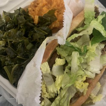 Dodah's Kitchen - Cheesesteak, collard greens, yams (don't be fooled by the lettuce, there was PLENTY on and falling out that hoagie). - Vegan Near Me - Baltimore, Maryland Dodah's Kitchen - Cheesesteak, collard greens, yams (don't be fooled by the lettuce, there was PLENTY on and falling out that hoagie). - Vegan Near Me - Baltimore, Maryland