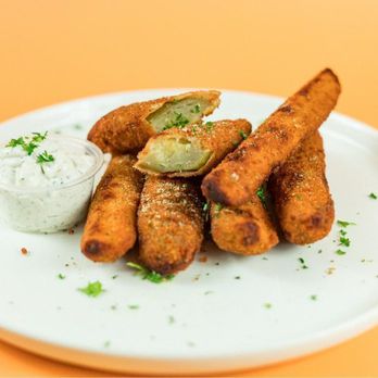 Santorinis - West Bountiful - Fried Pickles at Santorini's West Bountiful: Crispy fried pickle spears served with our house-made Tzatziki sauce. A savory local favorite! - Greek Near Me - West Bountiful, Utah Santorinis - West Bountiful - Fried Pickles at Santorini's West Bountiful: Crispy fried pickle spears served with our house-made Tzatziki sauce. A savory local favorite! - Greek Near Me - West Bountiful, Utah