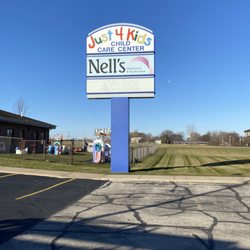 Nell's Wigs & Boutique - Outside Sign! we are the first building as you enter the lot!