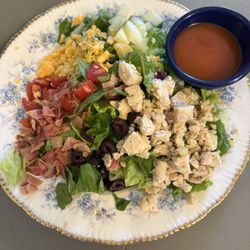 Kickapoo Tearoom and Boutique - Chopped Chef Salad chicken, tomatoes, cucumbers, cheddar cheese, kalamata olives, bacon, hard-boiled egg & choice of dressing on the side