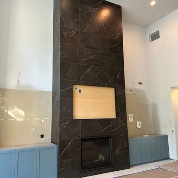 Timeless Creations - Custom 3 story fireplace in large format tiles - Tiling Near Me Timeless Creations - Custom 3 story fireplace in large format tiles - Tiling Near Me