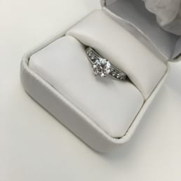 Custom Diamond Engagement Ring I got from Paul. Center Stone is 1 karat with graduated diamonds on the sides. Total weight is over 1.5 karat