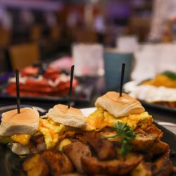 Pastores + Brunch - BREAK FAST SANDWICH 3HAWAIAN ROLLS HAM OR BACON CHEDDAR SCRAMLE EGGS HOUSE POTATOES OR FRUITR