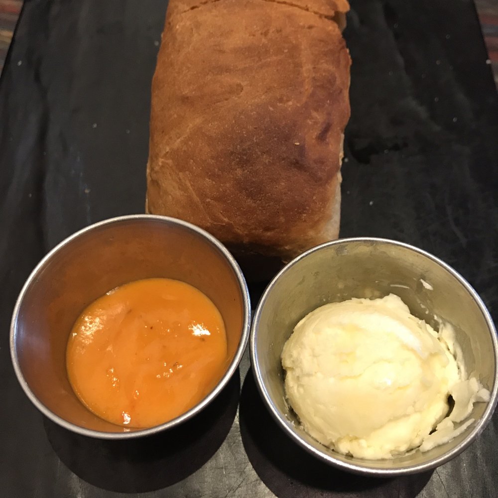 Sisserou's Caribbean Restaurant & Catering - Loaf of fresh Jamaican bread with butter and (spicy!) pepper sauce - Caribbean Near Me - Tulsa, Oklahoma Sisserou's Caribbean Restaurant & Catering - Loaf of fresh Jamaican bread with butter and (spicy!) pepper sauce - Caribbean Near Me - Tulsa, Oklahoma