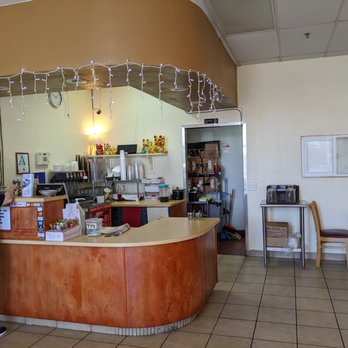 Golden Thai Kitchen - a woman standing at the counter - Thai Near Me - Phoenix, Arizona Golden Thai Kitchen - a woman standing at the counter - Thai Near Me - Phoenix, Arizona