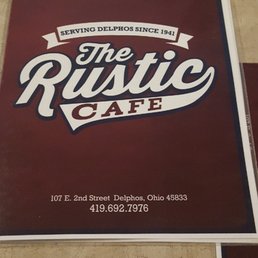 a sign for the rustic cafe
