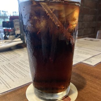 McGlynns Pub - a glass of soda on a table - Pubs Near Me - Newark, Delaware McGlynns Pub - a glass of soda on a table - Pubs Near Me - Newark, Delaware