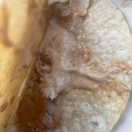 My 2nd taco isn't completely cracked but this is how sad the chicken ratio inside is. My 2nd taco isn't completely cracked but this is how sad the chicken ratio inside is.