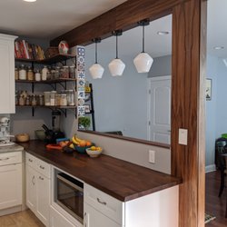 Quigley Construction - new kitchen cabinets with overhead beam and lights