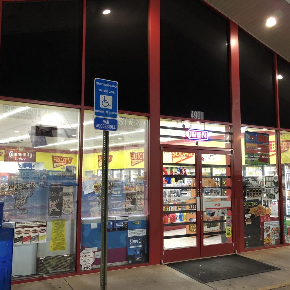 Shell - a storefront with a sign in front of it - Gas Stations Near Me - Norcross, Georgia