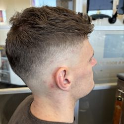 Summerlin Barbershop - High 0' fade with textured crown.