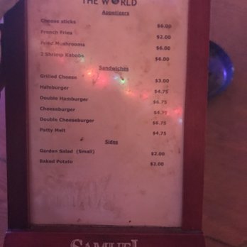 The World - a menu on a wooden table - New American Near Me - Delta, Louisiana The World - a menu on a wooden table - New American Near Me - Delta, Louisiana