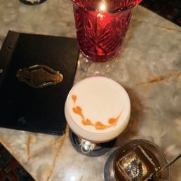 Cocktails from the lounge area. Amaretto with an egg white foam and a whisky cocktail with aromatics. Cocktails from the lounge area. Amaretto with an egg white foam and a whisky cocktail with aromatics.