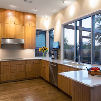 Nick Mehl Architecture - Kitchen looking onto screened porch and pool. - Architects Near Me - Austin, Texas