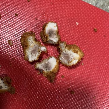 Chick-fil-A - ows a piece of chicken on a red cutting board - Fast Food Near Me - The Woodlands, Texas Chick-fil-A - ows a piece of chicken on a red cutting board - Fast Food Near Me - The Woodlands, Texas