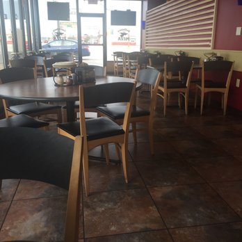 Godfather's Pizza - tables and chairs in a restaurant - Pizza Near Me - Springfield, Illinois Godfather's Pizza - tables and chairs in a restaurant - Pizza Near Me - Springfield, Illinois