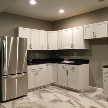 Olde Tyme Craftsmen - a kitchen with stainless steel appliances - General Contractors Near Me - Huntingtown, Maryland Olde Tyme Craftsmen - a kitchen with stainless steel appliances - General Contractors Near Me - Huntingtown, Maryland
