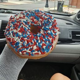 Vanilla raised donut with sprinkles