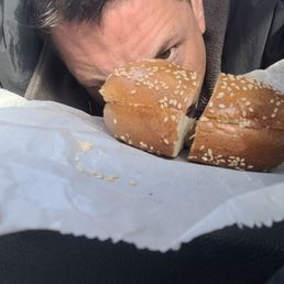 a man eating a bagel a man eating a bagel