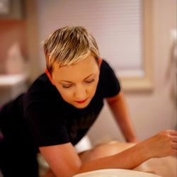 Jessica Oliveira Massage Therapy - Jessica applying massage therapy techniques to a client