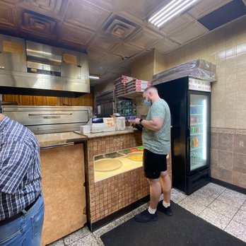 $1.50 Fresh Pizza - two men in a restaurant - Pizza Near Me - New York, New York $1.50 Fresh Pizza - two men in a restaurant - Pizza Near Me - New York, New York