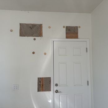 Insulation Alliance - Holes that the insulation blown in. We've cut around the door after, per inspection request. - Insulation Installation Near Me Insulation Alliance - Holes that the insulation blown in. We've cut around the door after, per inspection request. - Insulation Installation Near Me
